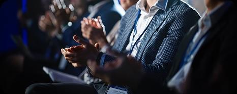 people in a crowd clapping